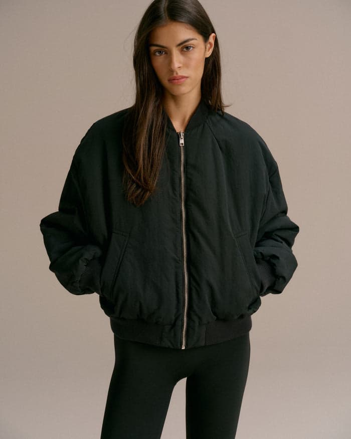 Black drop-shoulder reversible bomber