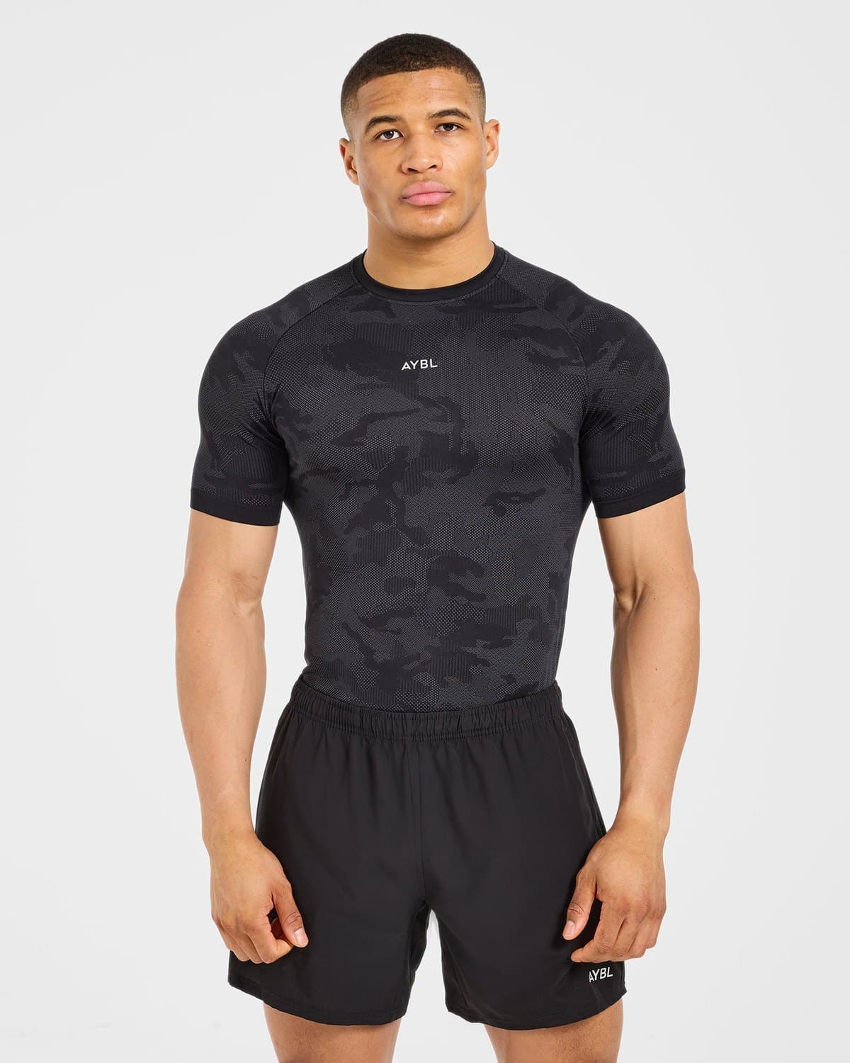 Male model in a black camo seamless performance t-shirt