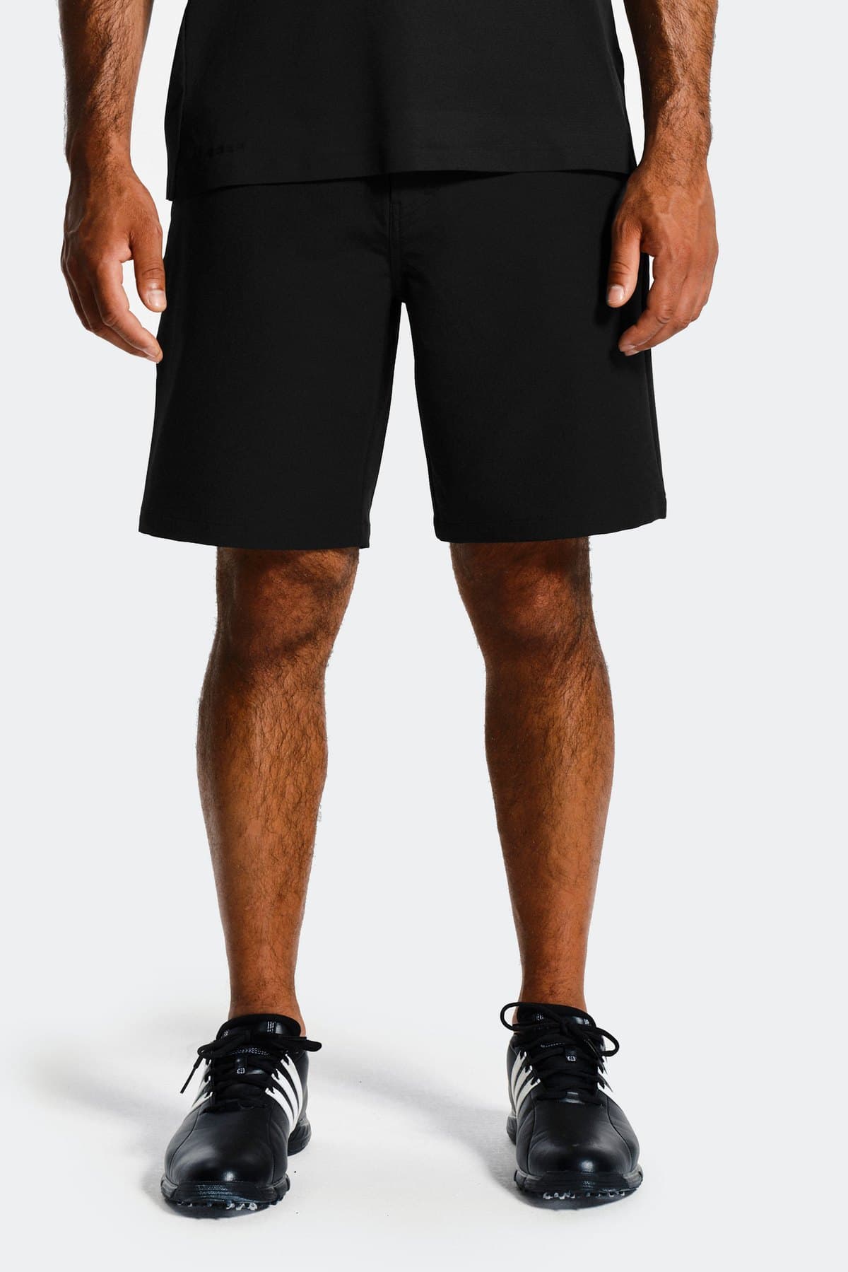 Male model in black technical training shorts